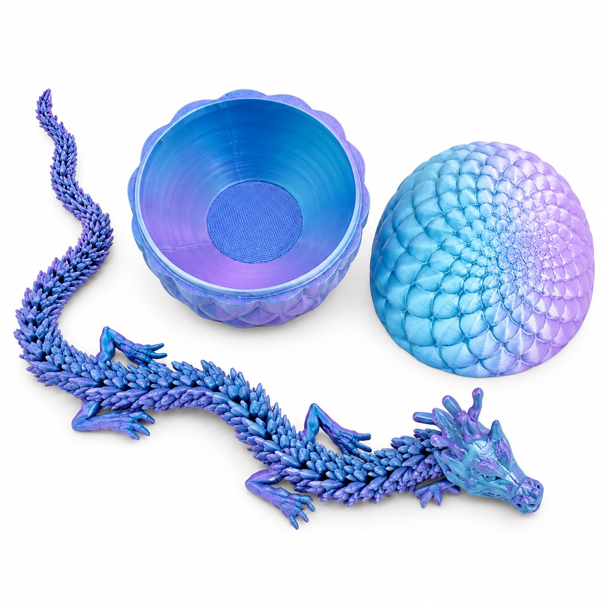 Light blue and purple articulated dragon with its open matching egg