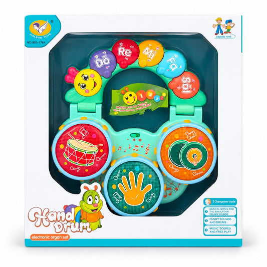 Musical hand drum toy with three drum pads and five note keys in its box